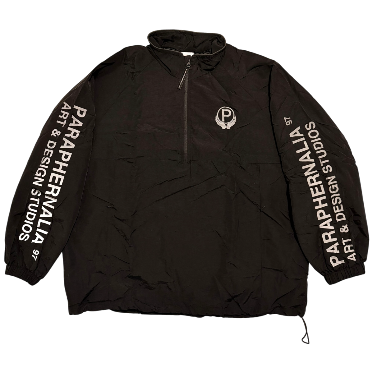 ℗ HALF ZIP WINDBREAKER